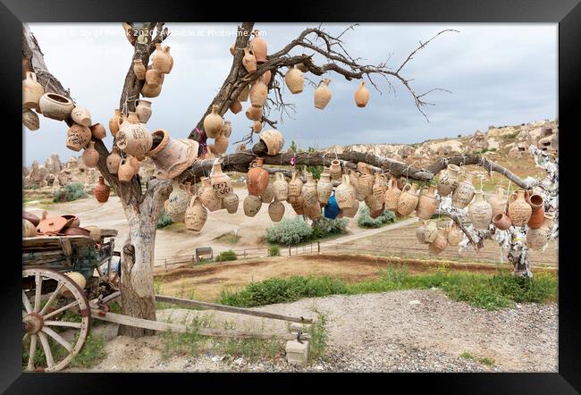 Tree Of Wishes with clay pots in Cappadocia. Framed Print by Sergii Petruk