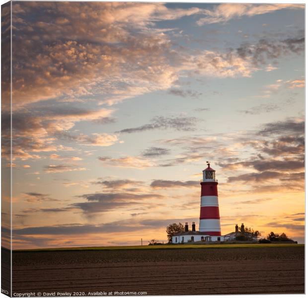 Sunset clouds over Happisburgh Lighthouse Canvas Print by David Powley