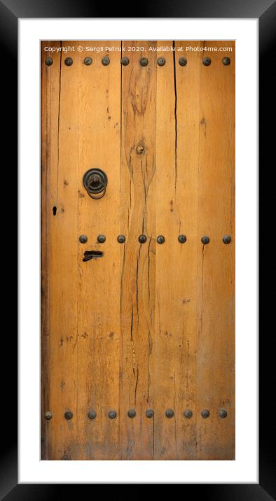old wooden door with wrought iron rivets Framed Mounted Print by Sergii Petruk