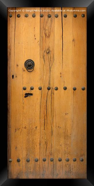 old wooden door with wrought iron rivets Framed Print by Sergii Petruk