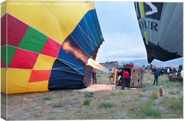 13.05.2018. Cappadocia, Goreme, Turkey. The process of inflating hot air balloons Canvas Print by Sergii Petruk