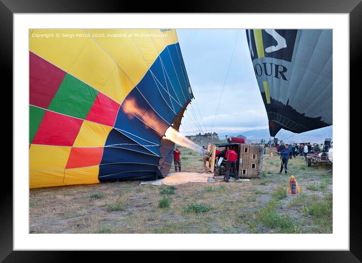 13.05.2018. Cappadocia, Goreme, Turkey. The process of inflating hot air balloons Framed Mounted Print by Sergii Petruk