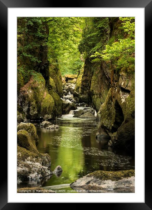 Stunning ethereal landscape of deep sided gorge with rock walls and stream flowing through lush greenery Framed Mounted Print by Matthew Gibson