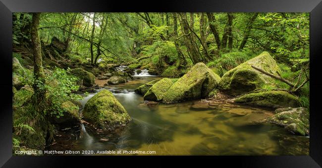 Beautiful landscape of river flowing through lush forest Golitha Falls in England Framed Print by Matthew Gibson