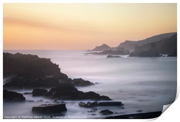 Beautiful long exposure landscape image of sea over rocks during vibrant sunset Print by Matthew Gibson