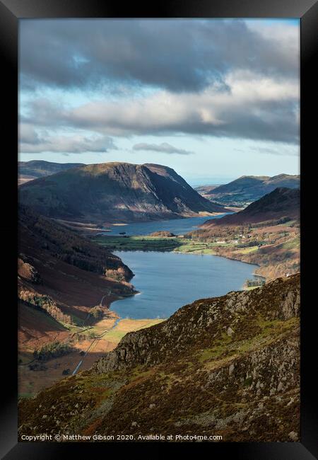 Majestic vibrant Autumn Fall landscape of Buttermere and Crummock Water flanked by mountain peaks of Haystacks High Stile and Mellbreak in Lake District Framed Print by Matthew Gibson