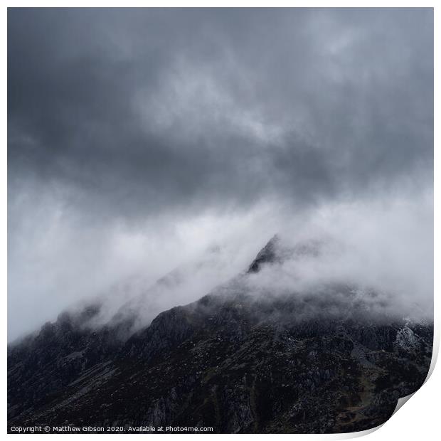 Stunning detail landscape images of snowcapped Pen Yr Ole Wen mountain in Snowdonia during dramatic moody Winter storm Print by Matthew Gibson
