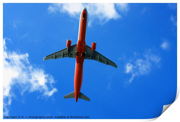 Passenger red airplane in the clouds and blue sky. Print by M. J. Photography