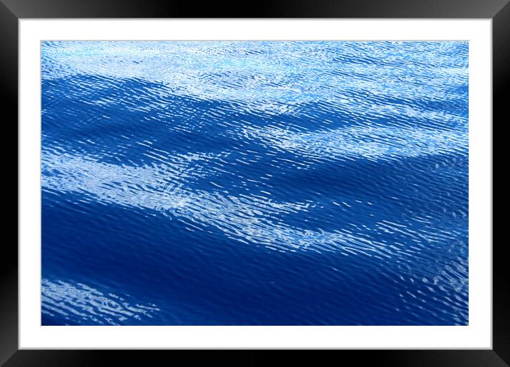 Ripples on a glassy sea. Framed Mounted Print by Tom Wade-West