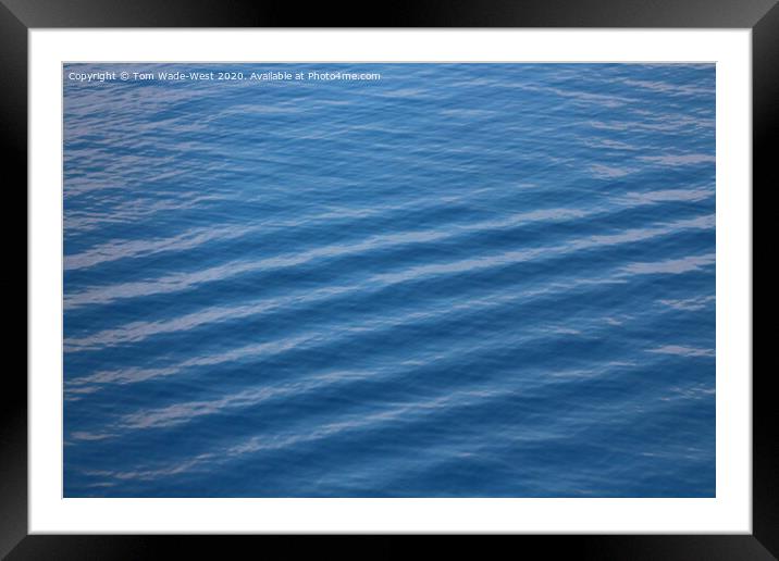 Ripples on a glassy sea. Framed Mounted Print by Tom Wade-West