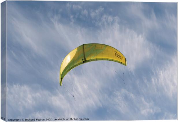 Yellow Kite Surf Flying Canvas Print by Richard Fearon