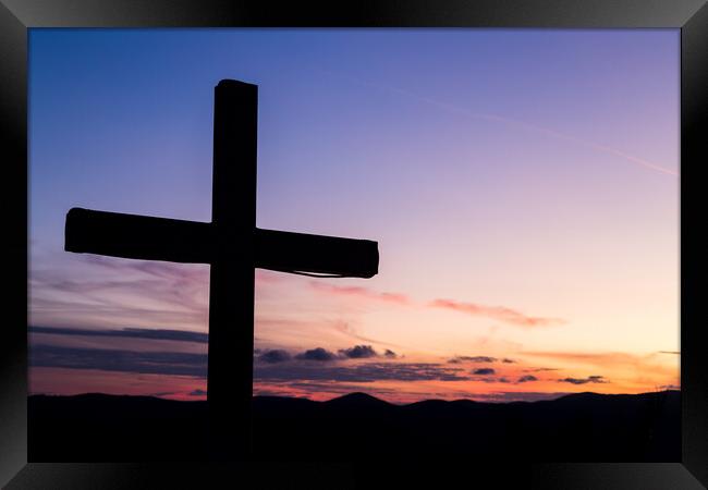 Silhouette of a large cross Framed Print by Jason Wells