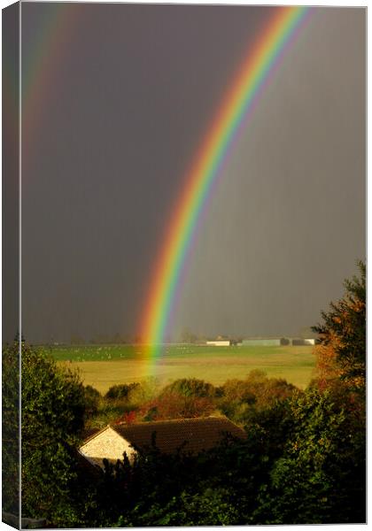 Rainbow over the farm Canvas Print by Jeremy Hayden