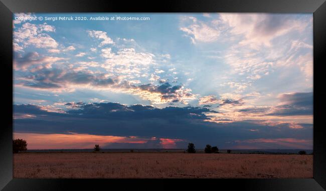 A great storm cloud closed the setting sun Framed Print by Sergii Petruk