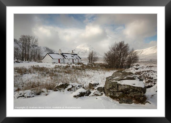 Black Rock Cottage, snowy Scottish scene. Glencoe Framed Mounted Print by Graham Binns