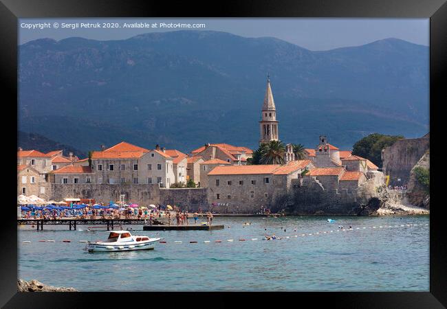 View of the beach and the old town of Budva in Montenegro against the background of blue-green mountains. August 2018. Framed Print by Sergii Petruk