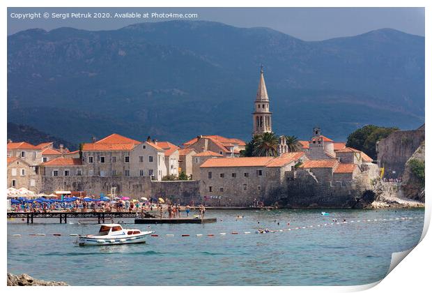 View of the beach and the old town of Budva in Montenegro against the background of blue-green mountains. August 2018. Print by Sergii Petruk
