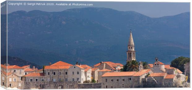 View of the old town of Budva in Montenegro against the background of blue-green mountains Canvas Print by Sergii Petruk