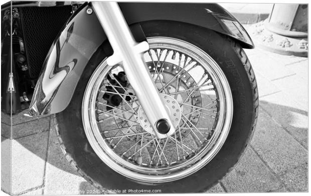 A motorcycle parked on the side of a road Canvas Print by M. J. Photography