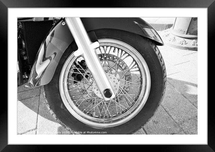 A motorcycle parked on the side of a road Framed Mounted Print by M. J. Photography