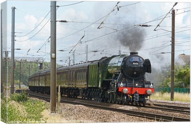 Flying Scotsman races away from York Canvas Print by David Mather