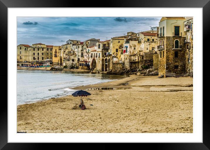 Beach with umbrella in the city of cefalu Framed Mounted Print by Mario Koufios