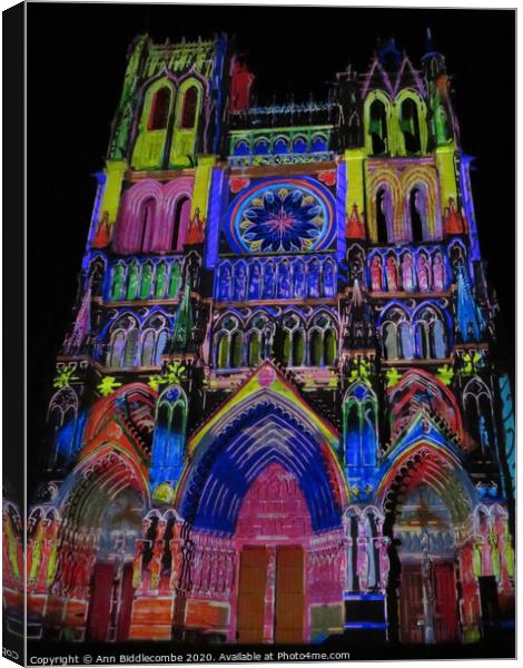 outdoor church lit up with colour Canvas Print by Ann Biddlecombe
