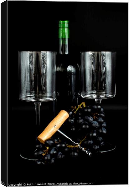 still life bottle of wine two. glasses and grapes  Canvas Print by keith hannant
