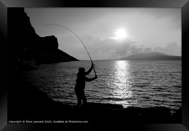 Young man fishing with feathers for mackerel B+W Framed Print by Rhys Leonard