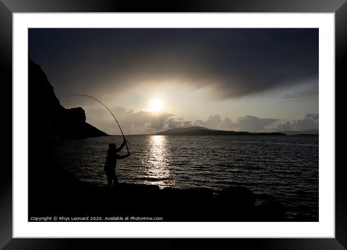 Young man fishing with feathers for mackerel Color Framed Mounted Print by Rhys Leonard
