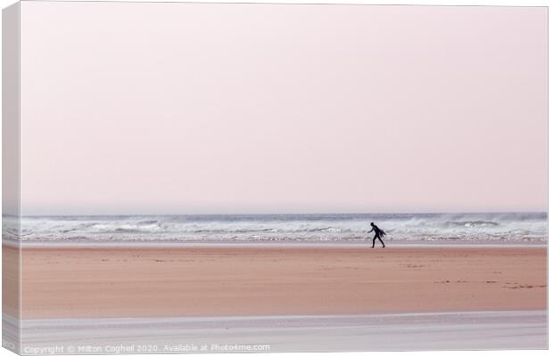 Lone surfer on Polzeath beach, Cornwall, UK Canvas Print by Milton Cogheil