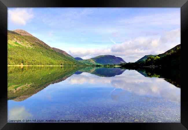 Reflections in Buttermere lake with Mellbreak mountain in Cumbria.  Framed Print by john hill
