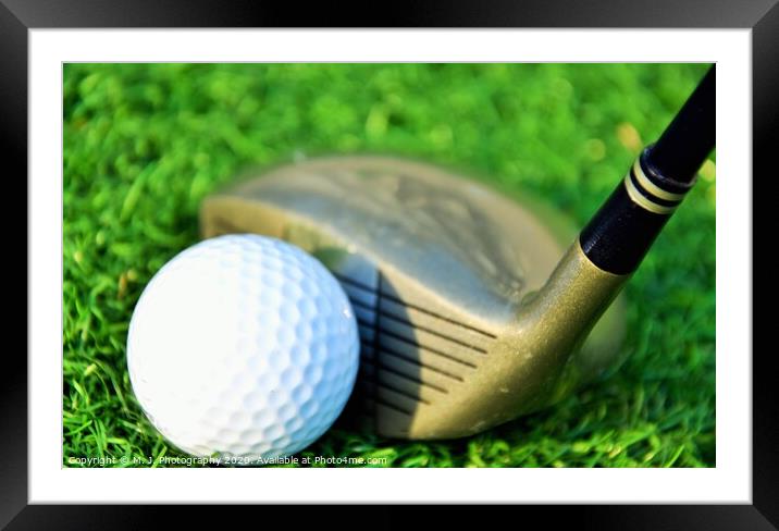 Stick with a ball on an artificial golf course Framed Mounted Print by M. J. Photography
