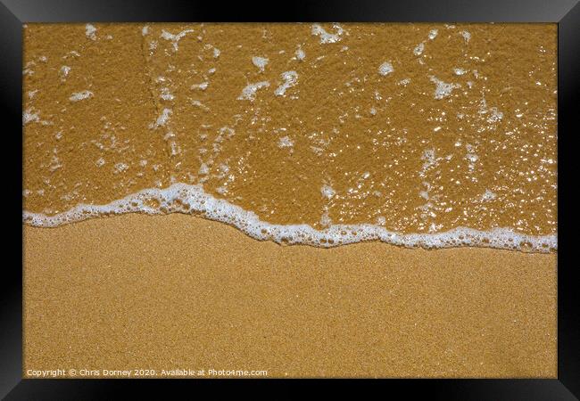 Seawater on the Beach Framed Print by Chris Dorney