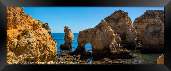 Grotto at Ponta da Piedade in the Algarve Framed Print by Chris Dorney