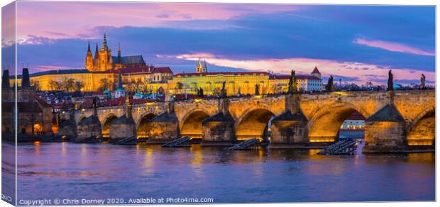Prague Castle and the Charles Bridge Canvas Print by Chris Dorney