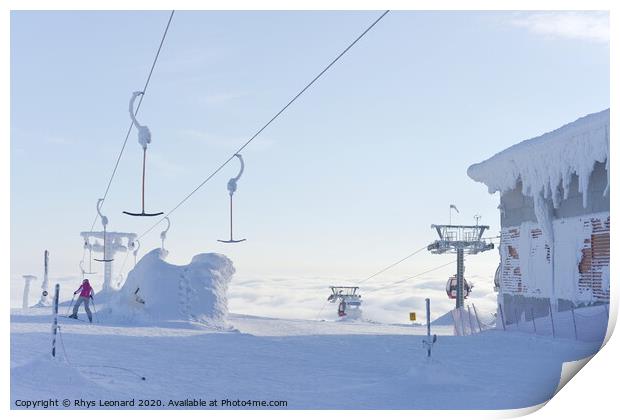 At the top of ski lifts rising above the clouds in Finland. Print by Rhys Leonard