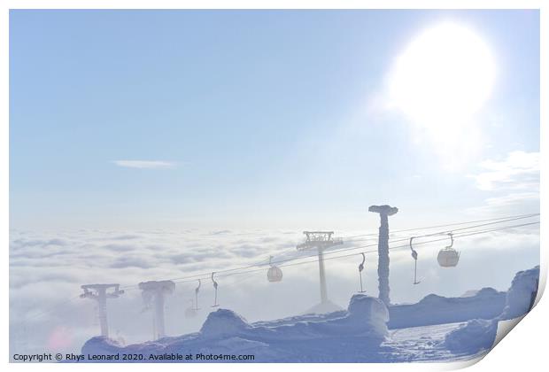 T-bar and gondola lifts emerge through the clouds into the sun Print by Rhys Leonard