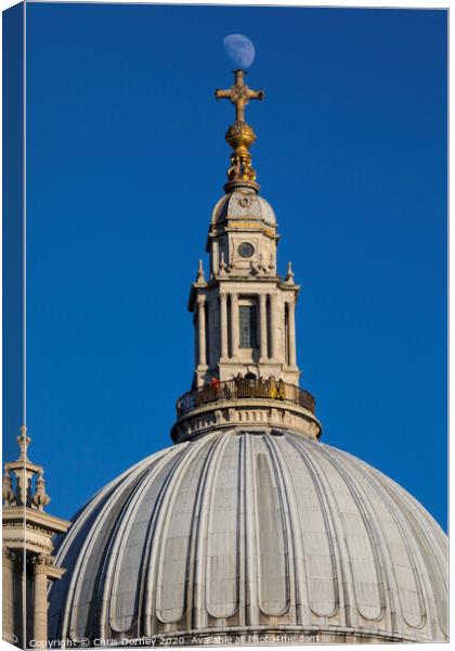 The Moon Perched on St. Pauls Cathedral Canvas Print by Chris Dorney