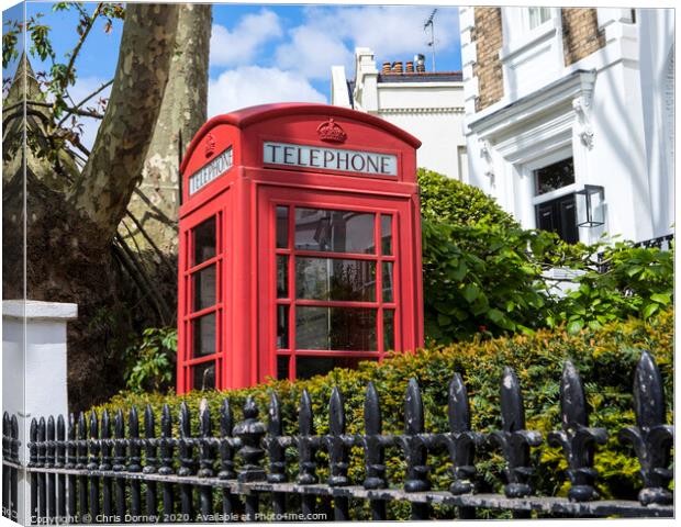 Red Telephone Box in London Canvas Print by Chris Dorney