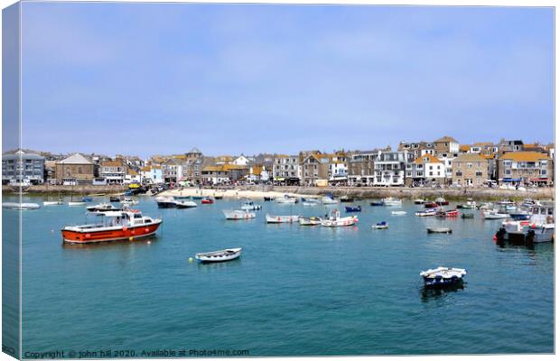 The beautiful seafront view from the harbour at St. Ives in Cornwall. Canvas Print by john hill