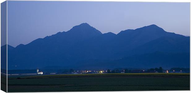 Krvavec and the Kamnik Alps at dawn, Slovenia. Canvas Print by Ian Middleton