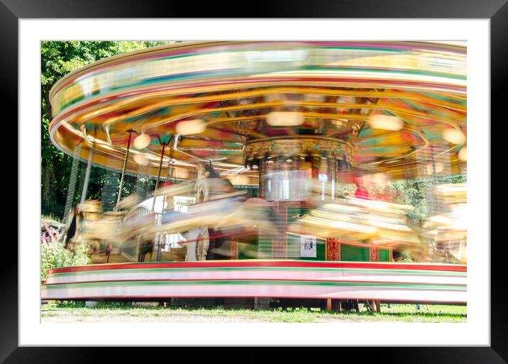 Carousel spinning  Framed Mounted Print by Richard Ashbee