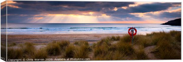 Sun rays at Freshwater West Canvas Print by Chris Warren