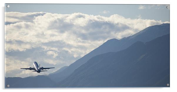 Airplane taking off over the alpine mountains Acrylic by Ian Middleton