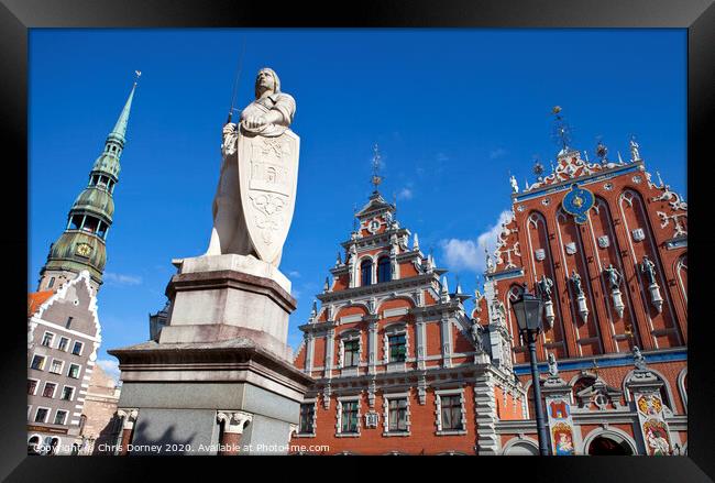 House of the Blackheads, St. Peter's Church and Saint Roland Statue in Riga Framed Print by Chris Dorney