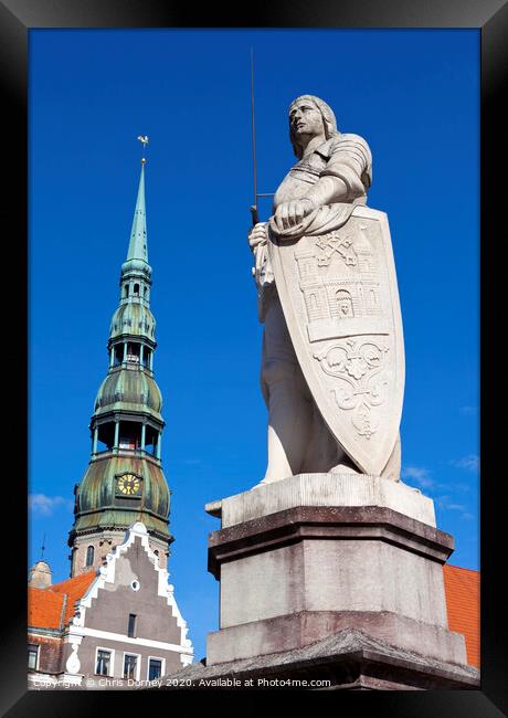 St. Roland Statue and St. Peter's Church in Riga Framed Print by Chris Dorney