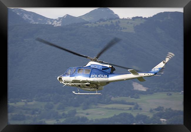 Police helicopter patrolling Framed Print by Ian Middleton