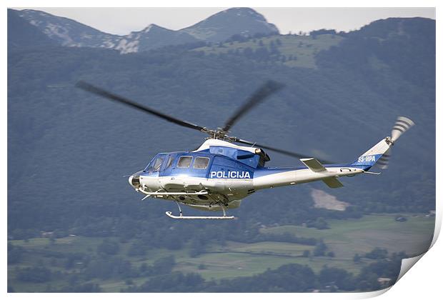 Police helicopter patrolling Print by Ian Middleton