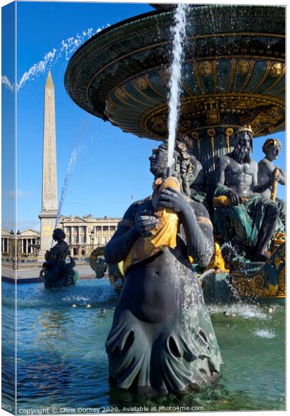 Fountain at Place de la Concorde in Paris Canvas Print by Chris Dorney